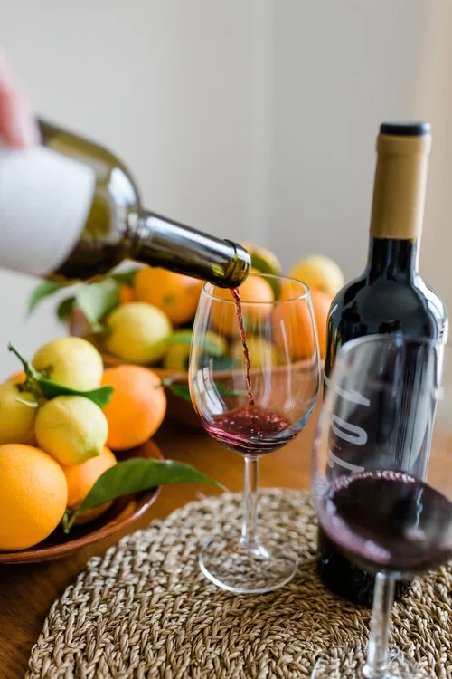 A still life in the Mediterranean sun — estate wine, fresh oranges and lemons on the stone terrace at MALLORCA ART RETREAT