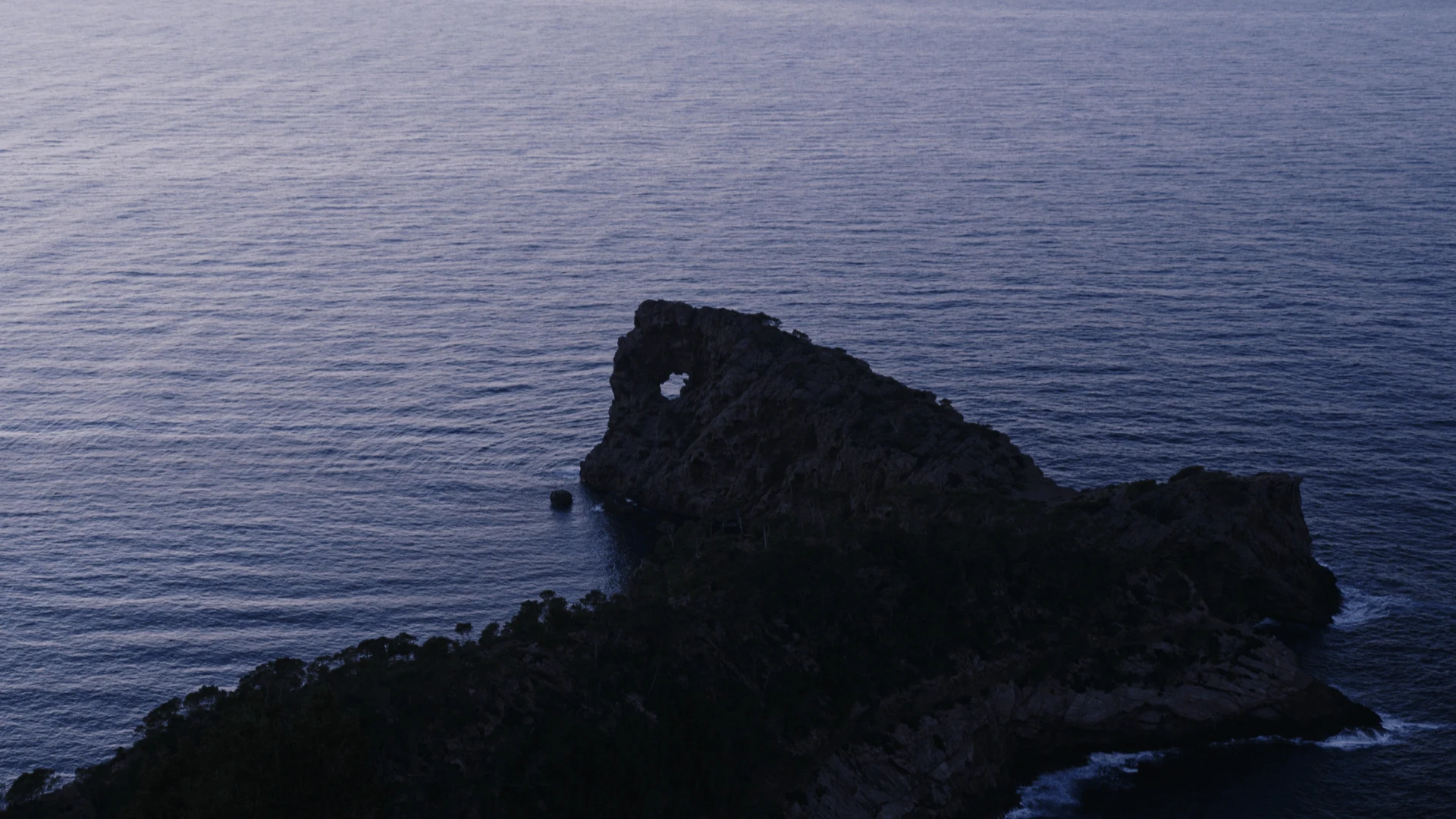 Mallorca coastline — limestone cliffs meeting turquoise water