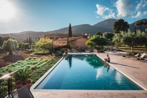 The wine at the table during an art retreat — aperitivo on the terrace, the day's painting behind you