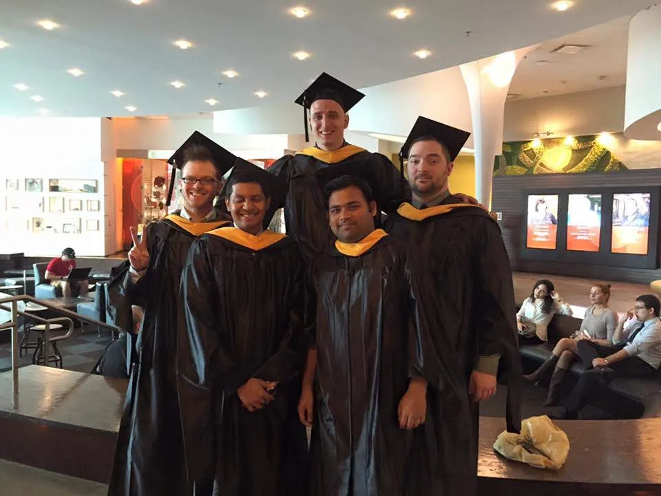 Graduation day with the crew — group in gowns
