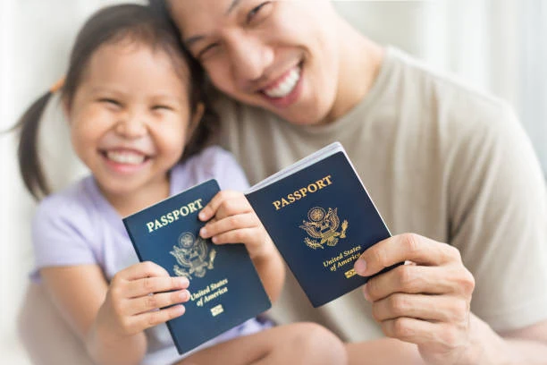 Parent and child holding United States passports — Fast Passport Center family expedited passport services