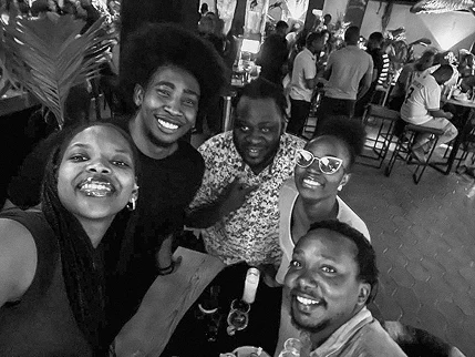 Four ADWrap colleagues smiling in a group selfie