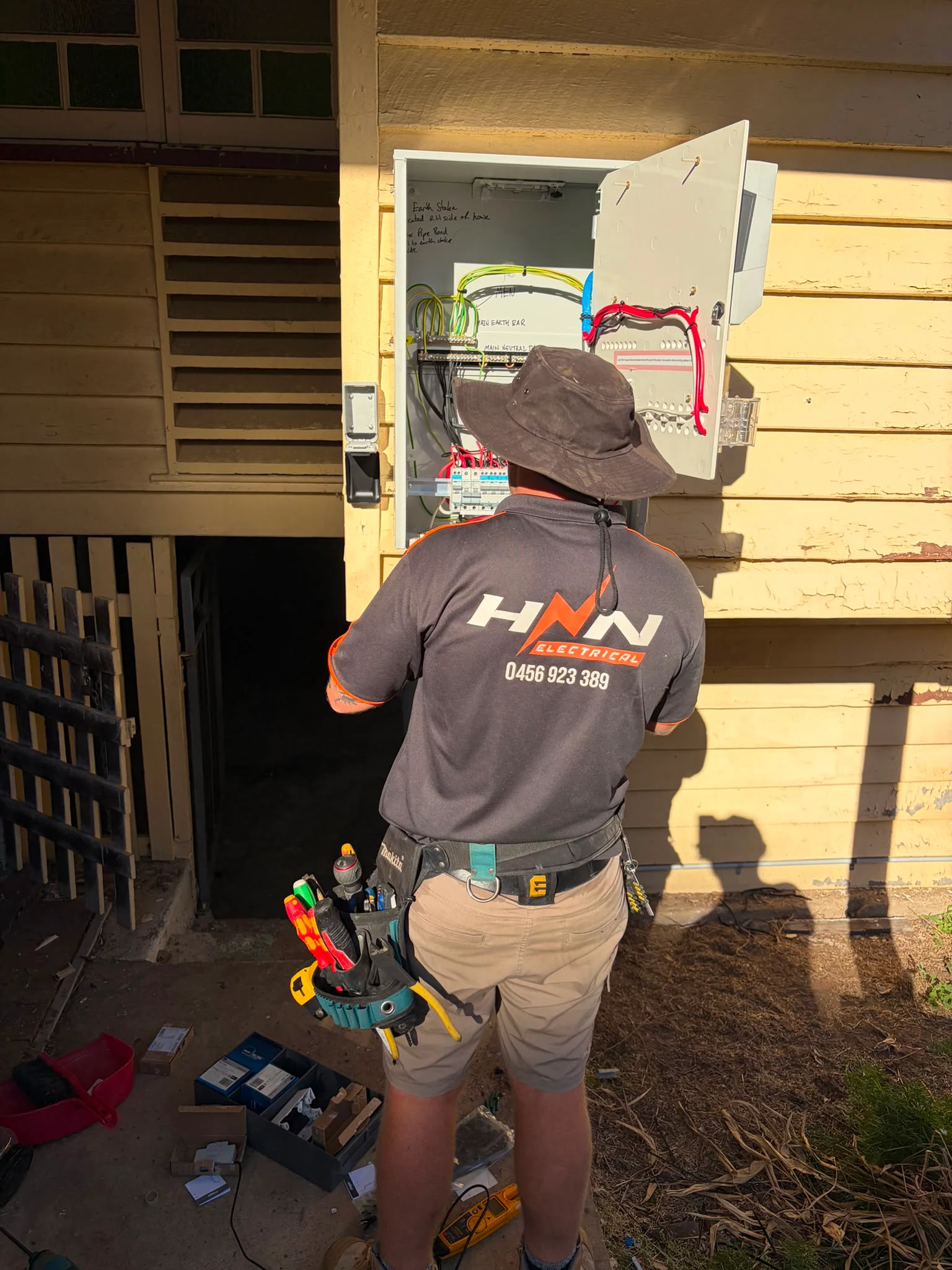 HNN Electrical electrician working on a switchboard