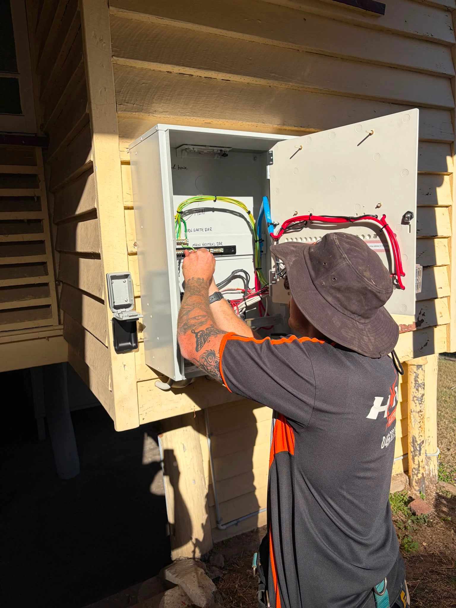 HNN electrician performing fault finding on an electrical panel